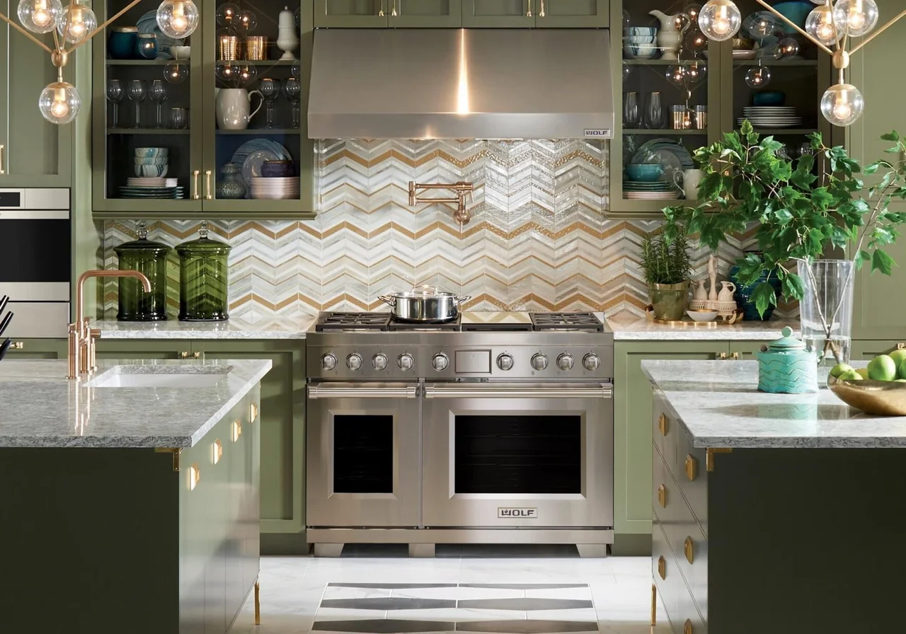 Wolf dual-fuel range installed in a green cabinetry kitchen