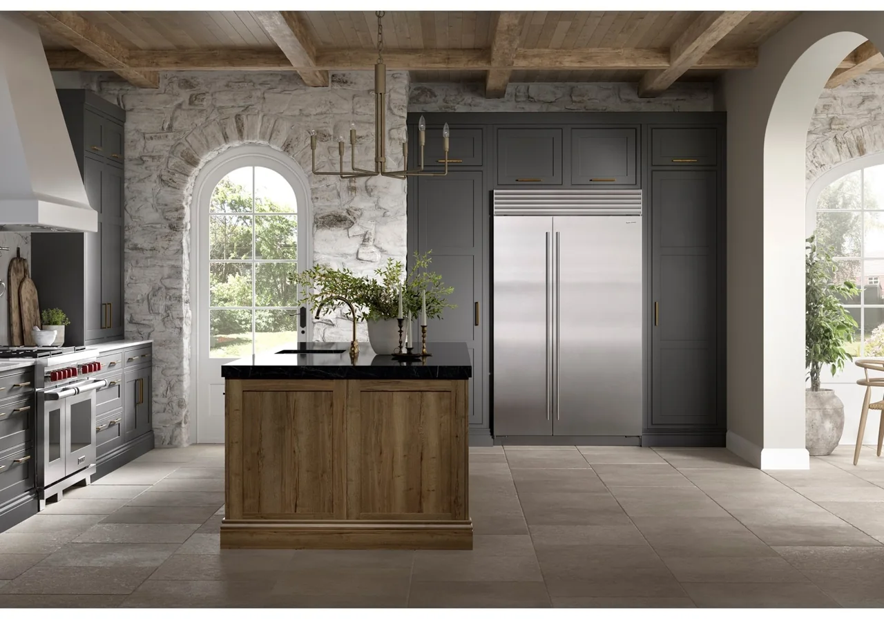 Sub-Zero CL4850S/S refrigerator-freezer installed in a stone and dark-cabinet kitchen